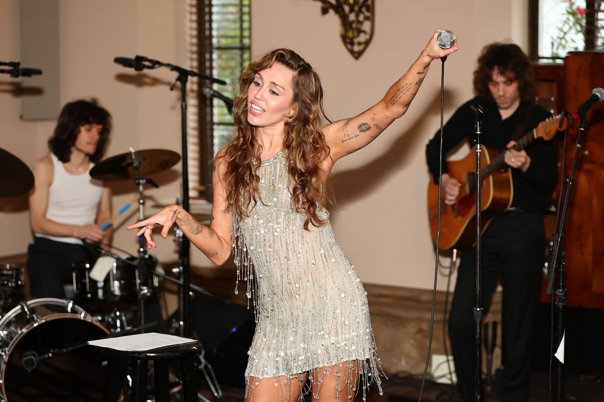Miley Cyrus performs during 'Something Beautiful' album release event at Chateau Marmont on May 27, 2025. (Image via Getty)
